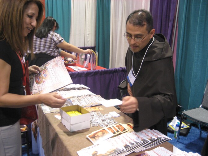 Carmelite Brother Edgar Enrique Lopez hands out information about his order at the recent Los Angeles Religious Education Congress in Anaheim.