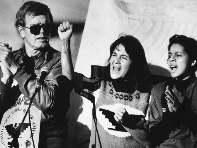 United Farm Workers leader Dolores Huerta (center) leads a rally along with Howard Wallace, President of the San Francisco chapter of the UFW (left) and Maria Elena Chavez, 16, the daughter of Cesar Chavez (right) in San Francisco’s Mission District on Nov. 19, 1988 as part of a national boycott of what the UFW claims is the dangerous use of pesticides on table grapes. 