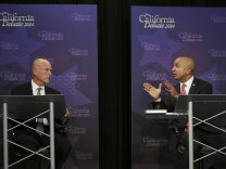 Gov. Jerry Brown, left, listens as Republican challenger Neel Kashkari speaks during a gubernatorial debate in Sacramento, Calif., Thursday, Sept. 4, 2014. Thursday's debate is likely to be the only one of the general election. (AP Photo/Rich Pedroncelli, Pool)