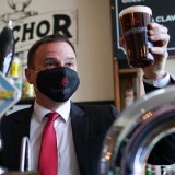 HARTLEPOOL, ENGLAND - APRIL 23: Dr Paul Williams, Labour Party candidate for Hartlepool pulls a pint during a visit to Cameron’s brewery in Hartlepool on April 23, 2021 in Hartlepool, England. The visit comes as the Labour Party campaigns in the town ahead of the May 6 by-election. (Photo by Ian Forsyth - WPA Pool /Getty Images)