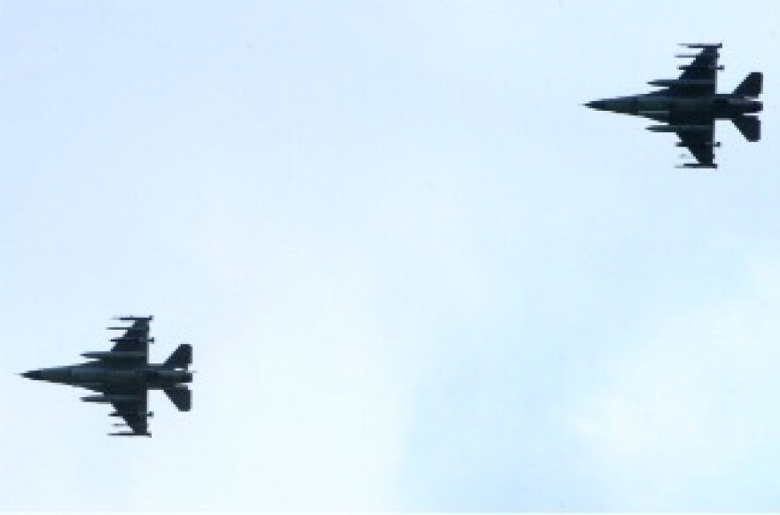 Two of the six Danish F16 fighter jets based in Italian military airport of Sigonella, southern Italy, land at the base after a mission of the international air campaign against Moamer Kadhafi's forces on March 21, 2011.