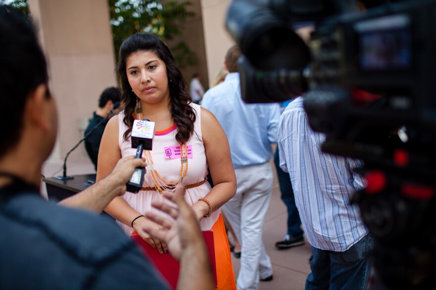 Marisol Ramirez, 20, a student and board member for Orange County Communities Organized for Responsible Development (OCCORD), is interviewed by the Spanish language press.