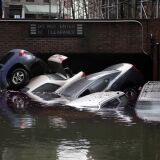 Cars are submerged at the entrance to a parking garage in New York's Financial District in the aftermath of superstorm Sandy, Tuesday, Oct. 30, 2012. New York City awakened Tuesday to a flooded subway system, shuttered financial markets and hundreds of thousands of people without power a day after a wall of seawater and high winds slammed into the city, destroying buildings and flooding tunnels.  (AP Photo/Richard Drew)