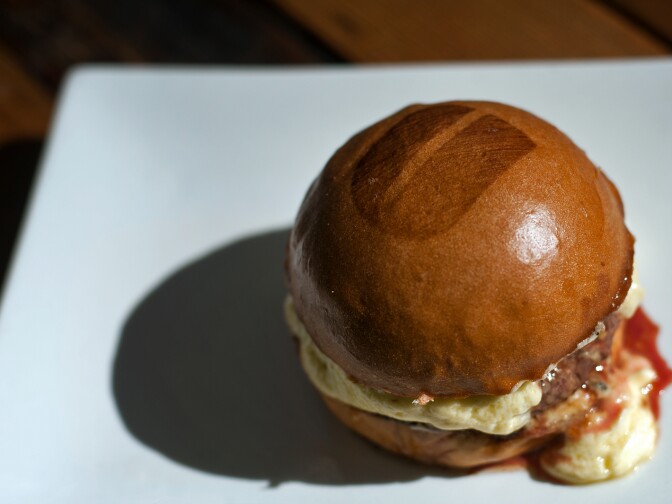 The Grove Truffle Burger, with parmesan fondue and truffle sauce, is exclusive to their flagship restaurant. Every Umami burger has a "U" on the top bun.