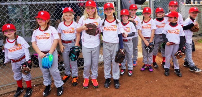 Coach Sean Eley assembled the Rockford Peaches with his daughter and her friends. They are the first ever West Seattle Little League team in the coach-pitch division composed entirely of girls.