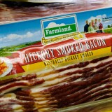 LOS ANGELES, CA - MAY 29:  Farmland's hickory smoked bacon is on sale at a supermarket on May 29, 2013 in Los Angeles, California.  Farmland is a brand owned by Smithfield Foods Inc, which is the biggest pork producer in the world.  A Chinese company based in Hong Kong, Shuanghui International Holdings Ltd. has agreed to buy Smithfield Foods Inc. for approximately $4.72 billion  (Photo by Kevork Djansezian/Getty Images)