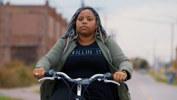 Dextina Booker rides her bike to work in Detroit in "Generation Startup."