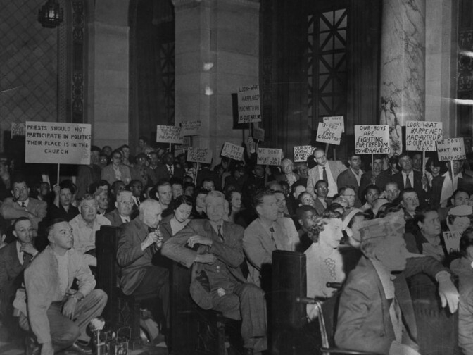 1951: "400 sign-waving residents of Chavez Ravine, protesting a proposed housing project that would take the sites of their homes, appeared April 26, 1951, at the City Planning Commission's final hearing on the matter. Sporadic booing and hissing swept over the crowd when a speaker suggested immediate approval of the project." Courtesy of the Los Angeles Public Library