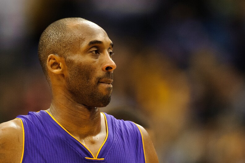 MINNEAPOLIS, MN - DECEMBER 14: Kobe Bryant #24 of the Los Angeles Lakers looks on during the fourth quarter of the game against the Minnesota Timberwolves on December 14, 2014 at Target Center in Minneapolis, Minnesota. The Lakers defeated the Timberwolves 100-94. NOTE TO USER: User expressly acknowledges and agrees that, by downloading and or using this Photograph, user is consenting to the terms and conditions of the Getty Images License Agreement. (Photo by Hannah Foslien/Getty Images)
