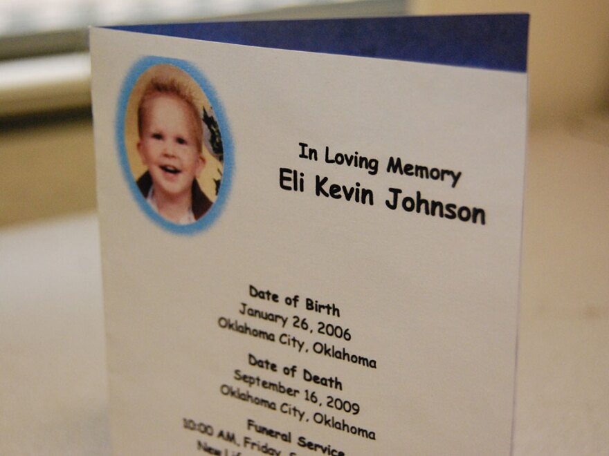 Eli Johnson's great-grandmother saved his funeral card. Three-year-old Eli was beaten to death in 2009.