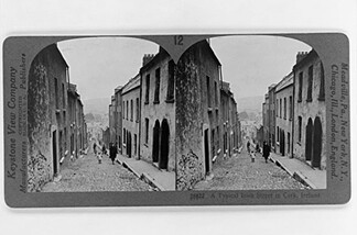An original Keystone stereo card of an Irish street scene. Note now the lines of the road and row houses receding toward the horizon on the left and right sides add to the stereo effect. UC Riverside holds the Keystone archive, but The Library of Congress also has thousands of stereo cards like these available for download.