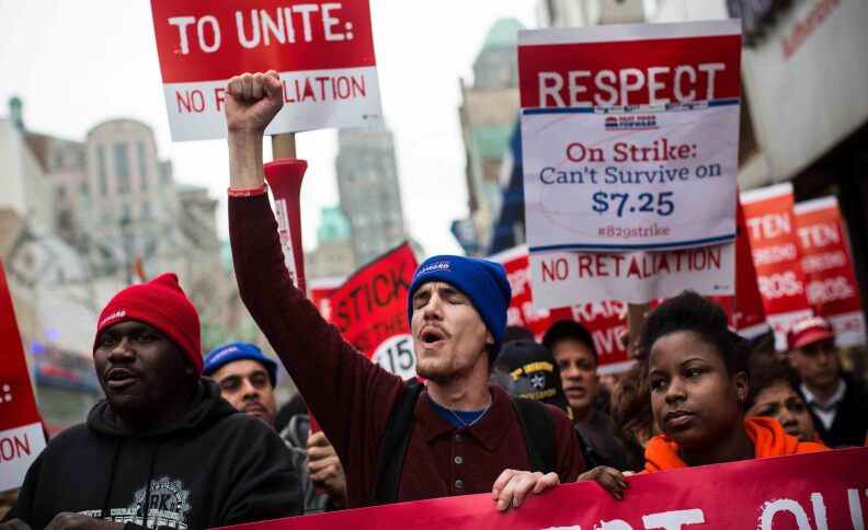 Protesters rally outside of a Wendy's in support of raising fast food wages from $7.25 per hour to $15.00 per hour on December 5, 2013 in the Brooklyn borough of New York City. A growing number of fast food workers in the United States have been staging protests outside restaurants, calling for a raise in wages, claiming it is impossible to live reasonably while earning minimum wage.  