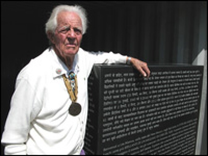 Ed Grothus, seen here with one of his "Doomsday Stones" — on which will sit a 32-foot granite obelisk inscribed with a screed against nuclear bombs, translated into 15 languages.