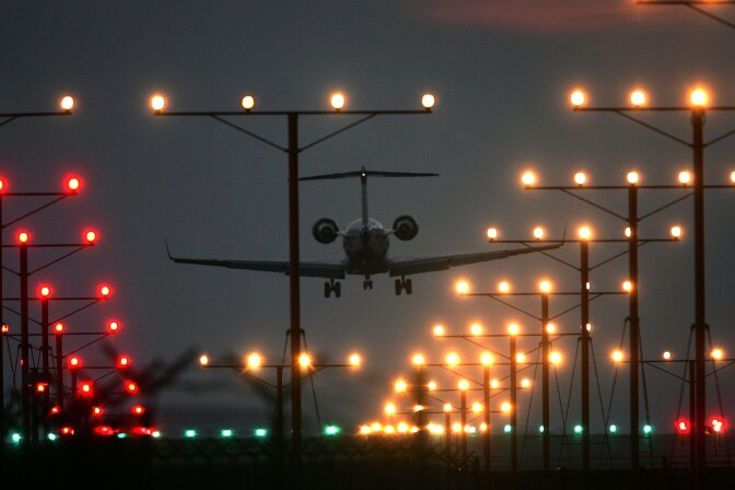 A jet lands at Los Angeles International Airport (LAX) on Thanksgiving eve, traditionally the busiest travel day of the year, November 22, 2006 in Los Angeles, California. The American Automobile Association (AAA) estimated 38.3 million people will travel 50 miles or more for Thanksgiving, and that 4.8 million travelers will fly to their Thanksgiving destinations. 
