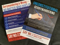 Two glossy mailers are displayed next to each other on a dark background. One reads "Unconstitutional gerrymandering" in large letters and the other reads "Gerrymandering is Wrong - No Matter Who Does It." 