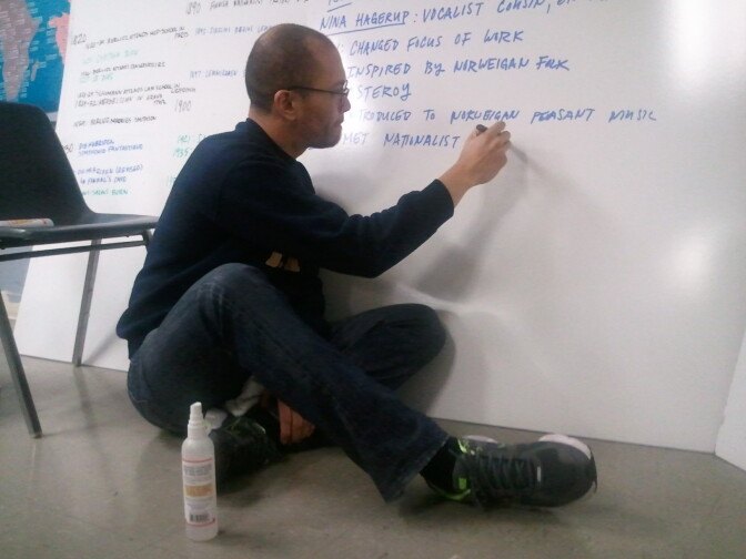 Franklin High School coach Sam Cullens writes questions on a dry erase board at one of the team's many study sessions
