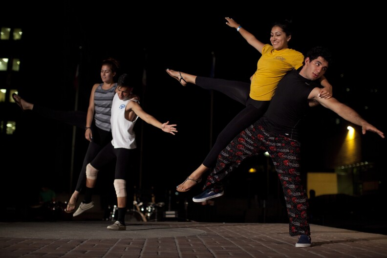 Dancers practice their routine for The Long Road Today, a play that will be performed outdoors in four different locations at the Santa Ana Civic Center Plaza.