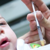 Child getting vaccinated for measles, mumps, and rubella (MMR)