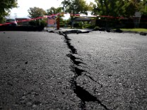 File: A crack runs down the center of an earthquake-damaged street on Aug. 26, 2014 in Napa, California.