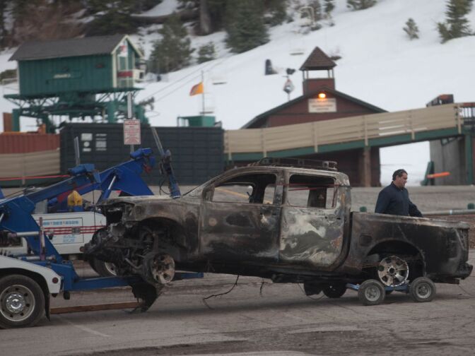 The truck belonging to Christopher Dorner is towed to a police command center at Bear Mountain Ski Resort. Police say Dorner burned the truck and a hunt for the suspect is ongoing.