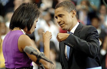 President Obama and First Lady Michelle Obama, with their signature gesture.