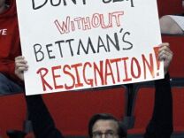 A fan shows holds up a sign showing his displeasure with NHL commissioner Gary Bettman while the Charlotte Checkers play the Norfolk Admirals in a American Hockey League hockey game at the PNC Arena on Sunday, January 6, 2013, in Raleigh, North Carolina. The Checkers are the Carolina Hurricanes highest-level minor league franchise. 