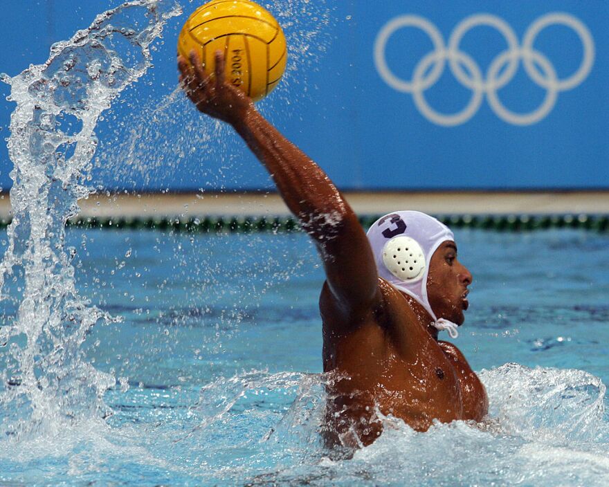 Olympic water polo player Omar Amr prepares to shoot against Hungary during the a men's preliminary match at the 2004 Summer Games.