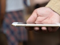 File: Tony Zhan checks out his new iPhone 6 Plus outside the Apple store in Pasadena on the first day of sale, Sept. 19, 2014.