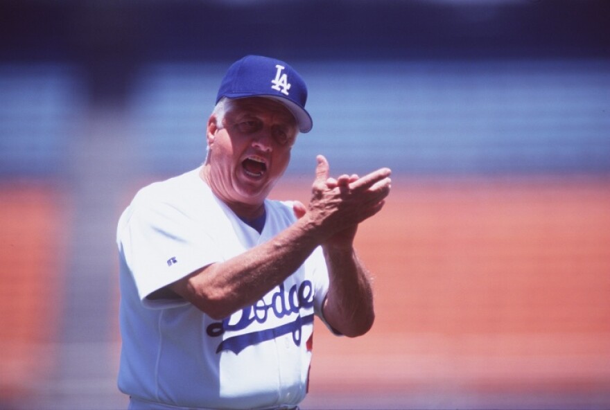 Manager Tommy Lasorda of the Los Angeles Dodgers applauds his players during the Dodgers versus Philadelphia Phillies game at Dodger Stadium in Los Angeles on June 11, 1995.