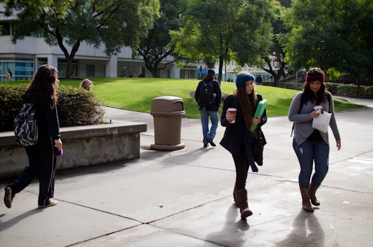 Cal State Fullerton students walk through the Quad on campus the morning after the campus was placed on lockdown when a robbery suspect was believed to have barricaded himself inside one of the buildings, Thursday, Dec. 13, 2012. Students return to class the day after.