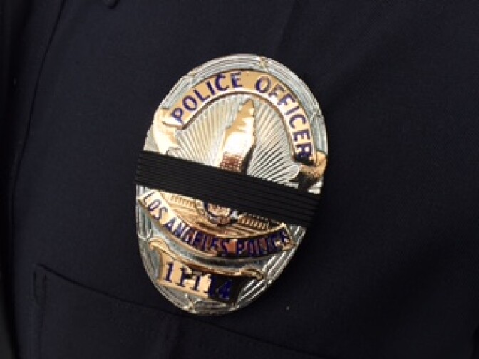 Police officers across Southern California are wearing black bands across their badges to mourn the deaths of five of their colleagues in Dallas.