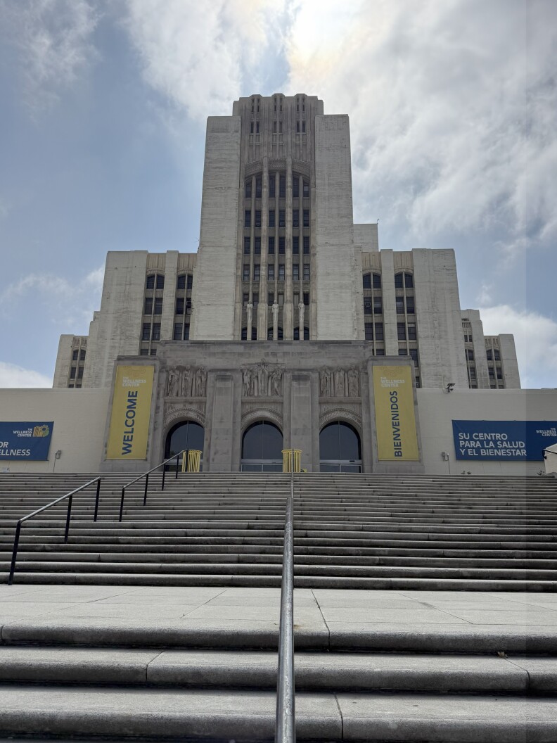 Dozens of concrete steps lead up to the Art Deco General Hospital building