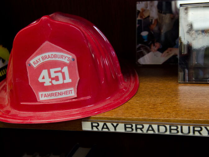 Decorated with a Fahrenheit 451 fire fighter hat along with other memorabilia, the Bradbury shelf has stood out among the bookshelves for quite some time.