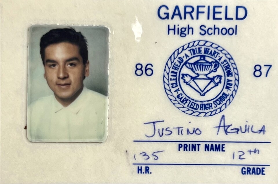 High school student ID card shows male presenting youth in white, buttown down shirt 