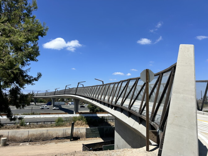 A bridge new bridge over a freeway.