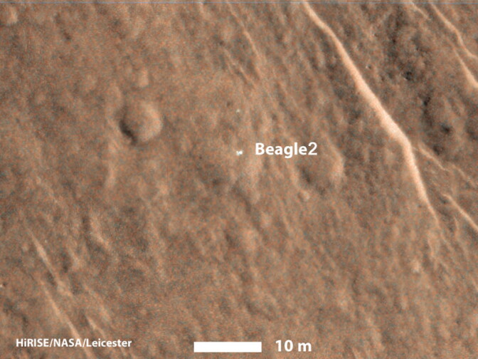 This annotated image shows a bright feature interpreted as the United Kingdom's Beagle 2 Lander with solar arrays at least partially deployed on the surface of Mars.