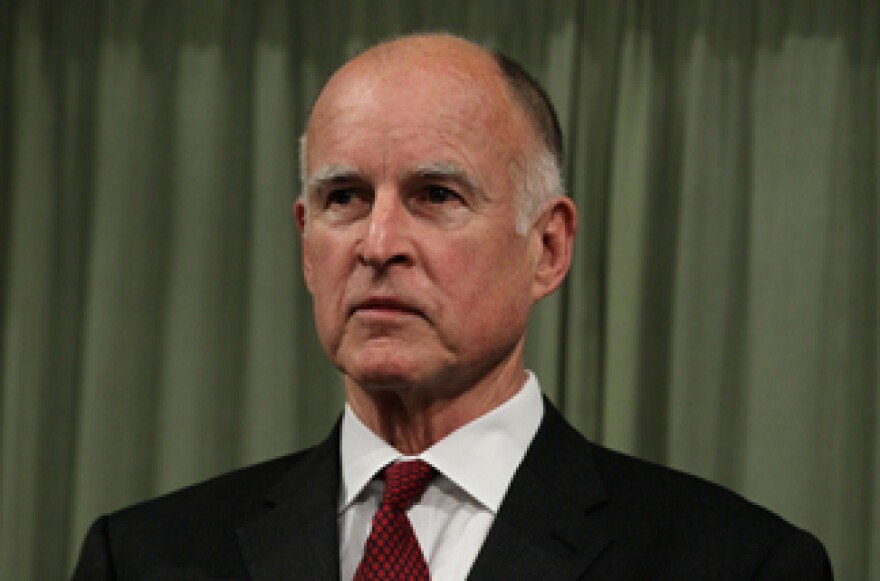 File photo: California Governor Jerry Brown looks on before delivering the State of the State address at the California State Capitol on January 31, 2011 in Sacramento, California.