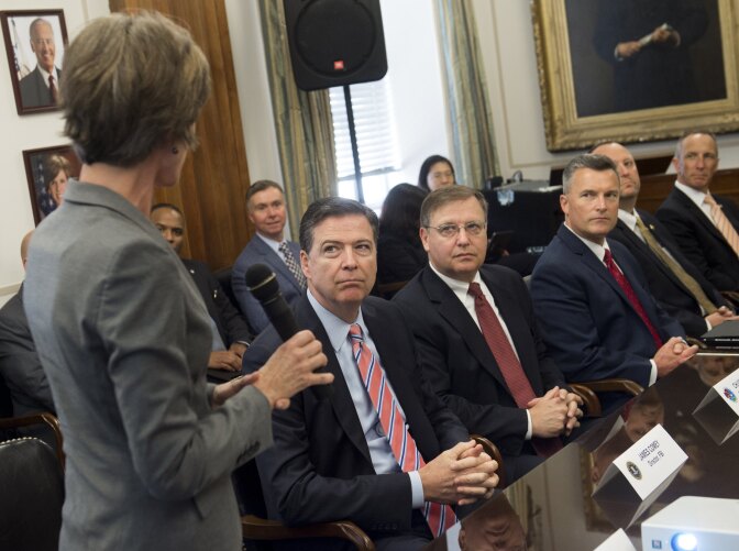 Deputy Attorney General Sally Q. Yates (L) speaks alongside FBI Director James Comey (2L) and Chuck Rosenberg (C), acting administrator of the Drug Enforcement Administration (DEA)as they attend a new Implicit Bias Training program at the Department of Justice in Washington, DC, June 28, 2016. / AFP / SAUL LOEB        (Photo credit should read SAUL LOEB/AFP/Getty Images)