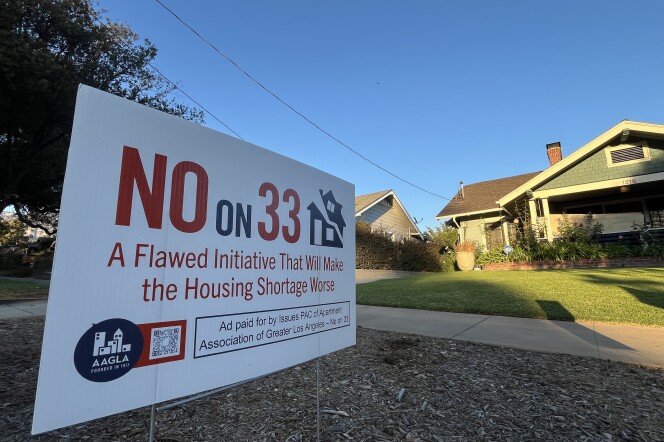 A "No on 33" sign is planted in front of a craftsman home.