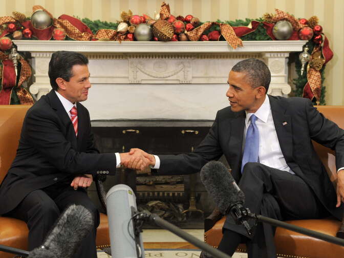 US President Barack Obama shakes hands with President-elect Enrique Pena Nieto of Mexico during a bilateral meeting in the Oval Office at the White House in Washington on November 27, 2012. Pena Nieto, a member of the Institutional Revolutionary Party (PRI), takes office on December 1, replacing Felipe Calderon from the conservative National Action Party (PAN), five months after his election victory.
