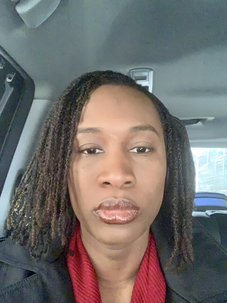 Morénike Giwa Onaiwu, a Black nonbinary woman with disabilities, taking a selfie.