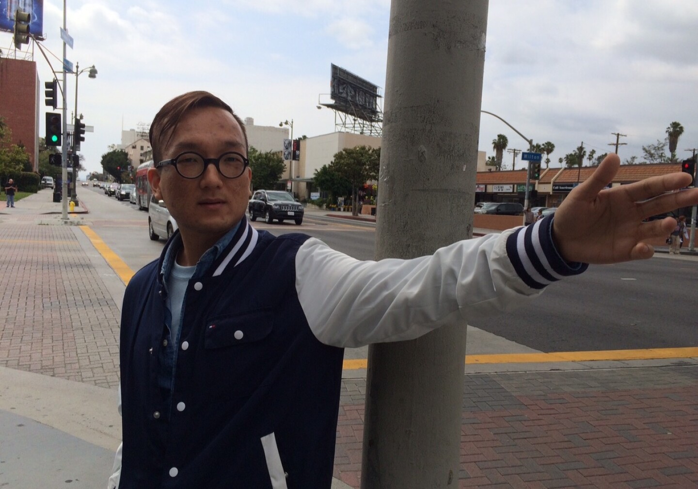 Steve Han stands on a busy street corner in Koreatown, Los Angeles, where he says the local community is addressing underage drinking among youth.