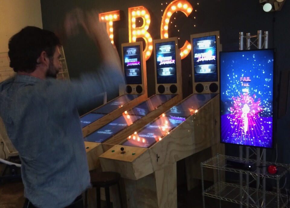 Brent Bushnell plays a game based on Japanese game shows that makes the player move like they are in a tetras game. “It’s a really active game and part of what makes this social is [just] look how ridiculous I am!”