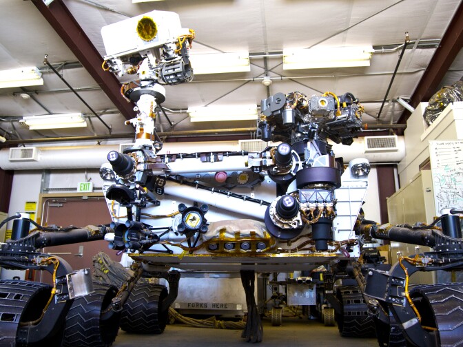 A working Mars rover sits in a shed adjacent to the Mars Yard at JPL. 