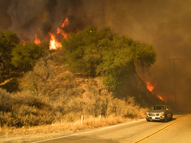 The Sand Fire burns intensely off Placerita Canyon Rd Sunday afternoon as a media vehicle races away from flames. 


The Sand Fire burns in the Angeles National Forest Sunday July 24th, 2016 under a Red Flag Warning high high winds. The fire had burned 22,000 acres by Sunday morning and was 10% contained as firefighters battled low humidity, shifting wind, and high temperatures. An unknown number of structures were lost. 