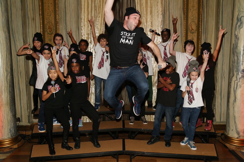 Cast members of the Broadway musical "School of Rock" perform during the Lotte New York Palace Tree Lighting Ceremony on November 29, 2016 in New York City.