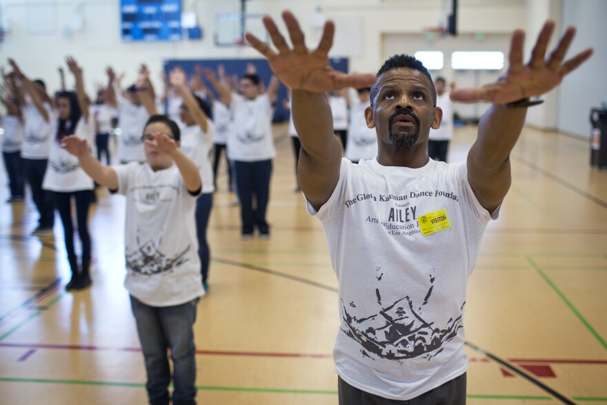 Teaching artist Michael Thomas takes part in leading almost 100 students during the four-day Alvin Ailey Revelations Residency at Rancho Dominguez Preporatory School in Long Beach on Thursday, March 12, 2015.
