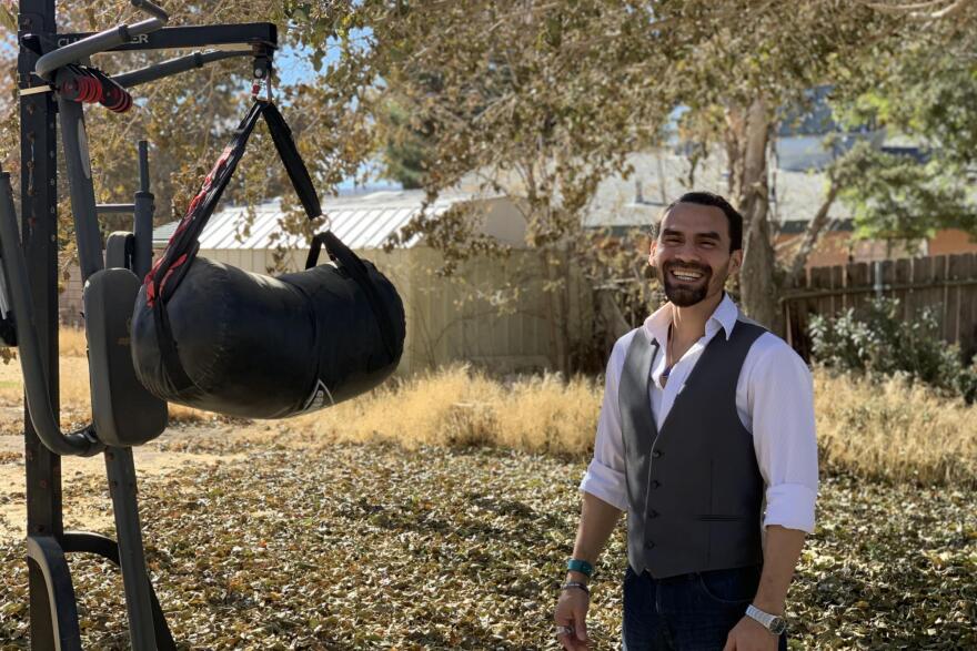Army veteran Jesus Medina says exercising with his punching bag helps him release pent-up energy. Medina says he's still dealing with grief from his time in the military.