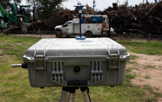 A plastic box with an antenna on top.