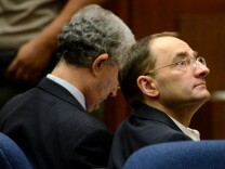 Defendant Christian Gerhartsreiter (right) from Germany sits during jury selection for his murder trial at Los Angeles Superior Court on March 15, 2013, in Los Angeles. Gerhartsreiter, the alleged Rockefeller impostor, is accused of killing his landllord, John Sohus, in February 1985. 